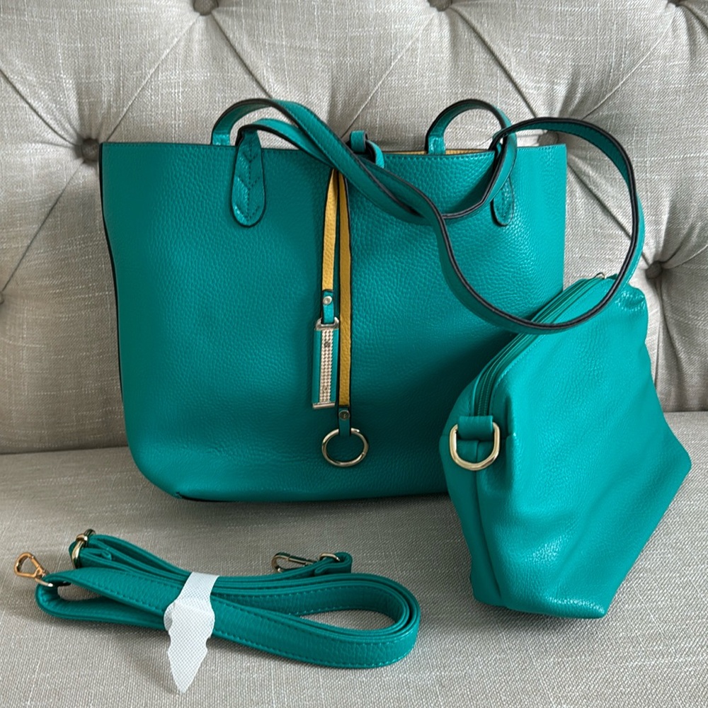 teal and yellow bag with accessories bag and strap.